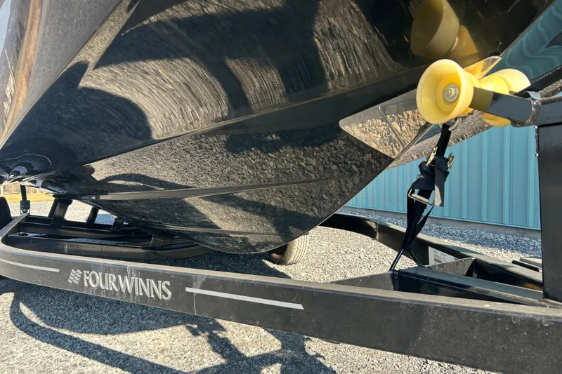 Slide: The Image of 2022 Four Winns HD2 OB boat on trailer, close-up view. - 32