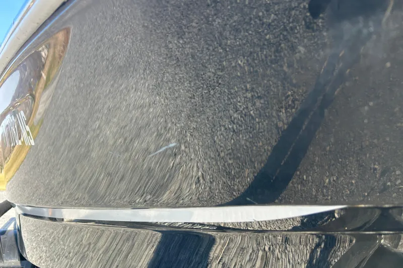 Slide: The Image of Close-up of 2022 Four Winns HD2 OB boat hull with reflective surface. - 33