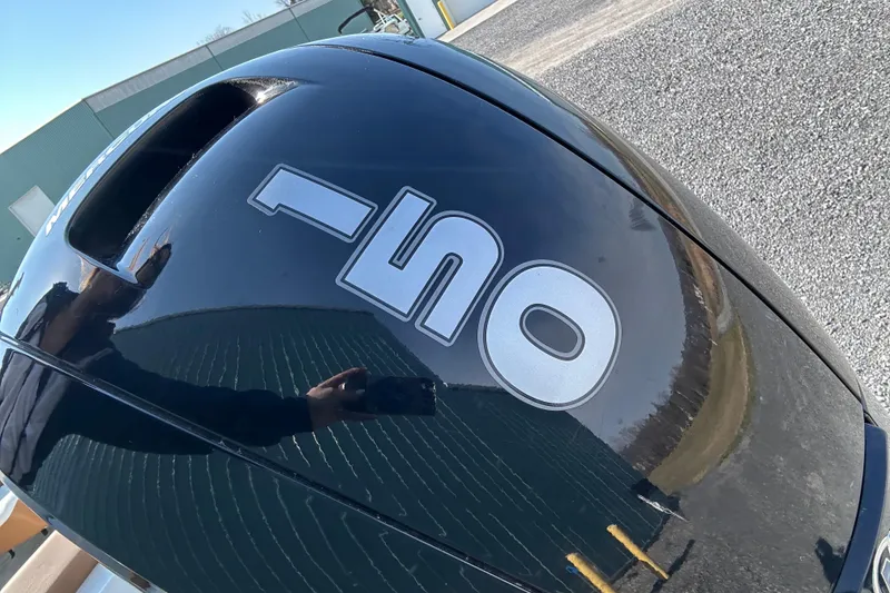 Slide: The Image of Close-up of a 2022 Four Winns HD2 OB outboard motor with "150" label. - 36