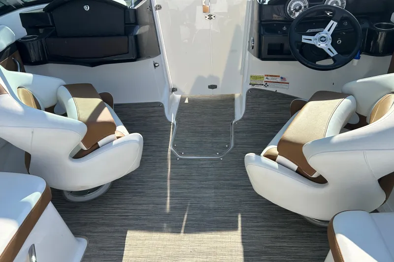 Slide: The Image of Interior of 2022 Four Winns HD2 OB boat with modern seating and steering wheel. - 40