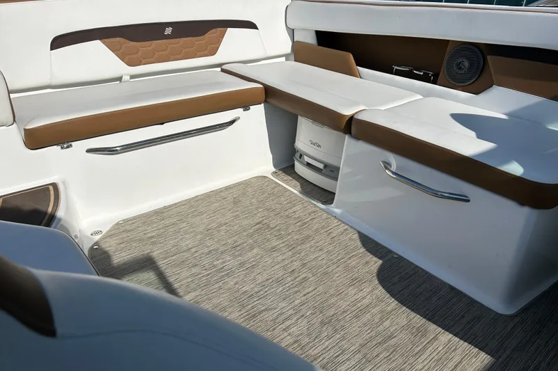 Slide: The Image of Interior seating of 2022 Four Winns HD2 OB boat with brown and white upholstery. - 42