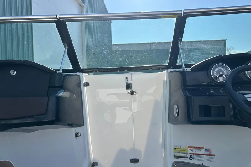 Slide: The Image of 2022 Four Winns HD2 OB boat interior with dashboard and seating area. - 43