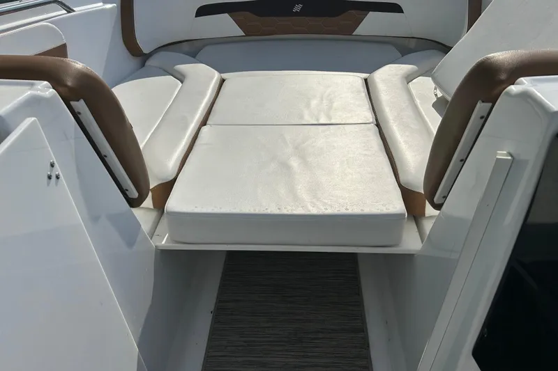 Slide: The Image of Interior seating of 2022 Four Winns HD2 OB boat with white cushions. - 46