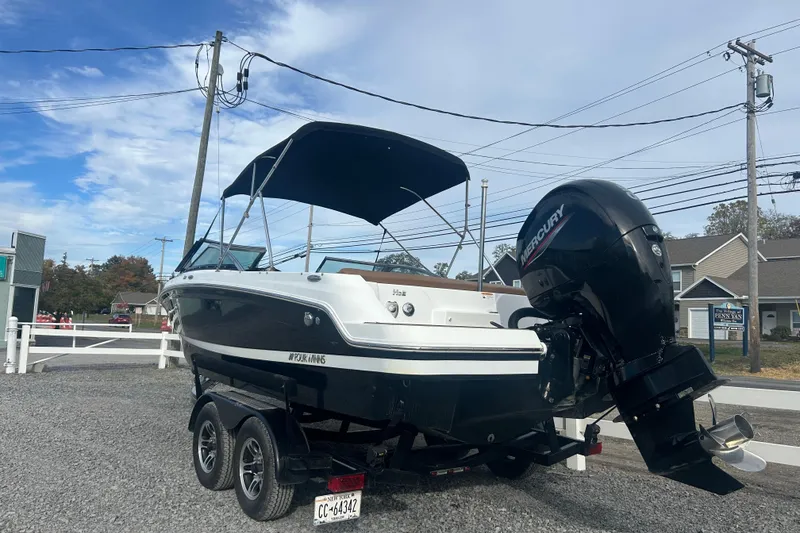 Slide: The Image of 2022 Four Winns HD2 OB boat with Mercury outboard motor on a trailer. - 6