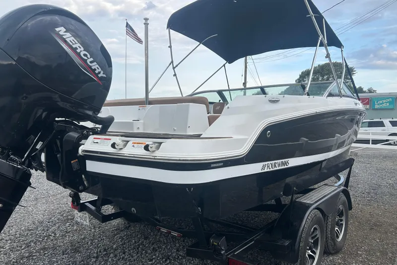 Slide: The Image of 2022 Four Winns HD2 OB boat with Mercury outboard engine on trailer. - 7