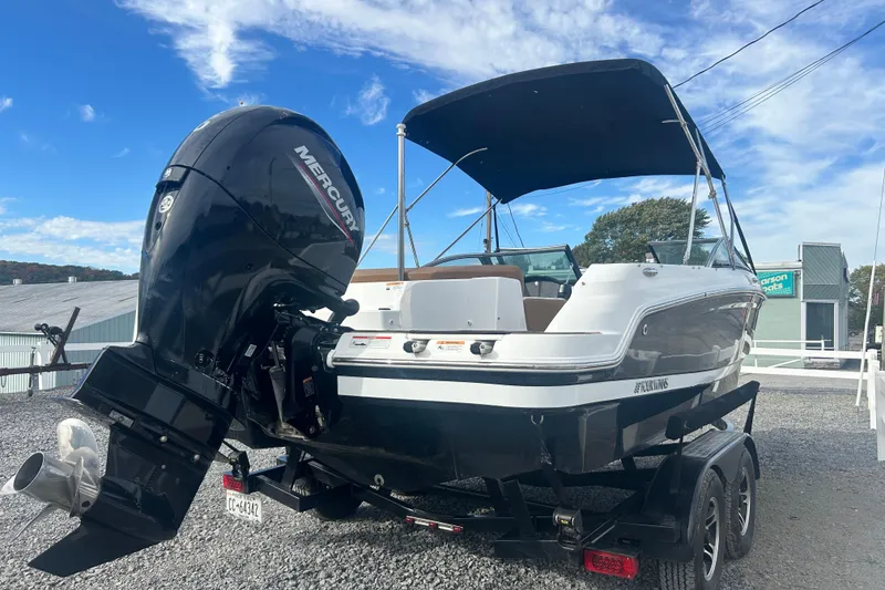 Slide: The Image of 2022 Four Winns HD2 OB boat with Mercury outboard engine on trailer. - 8