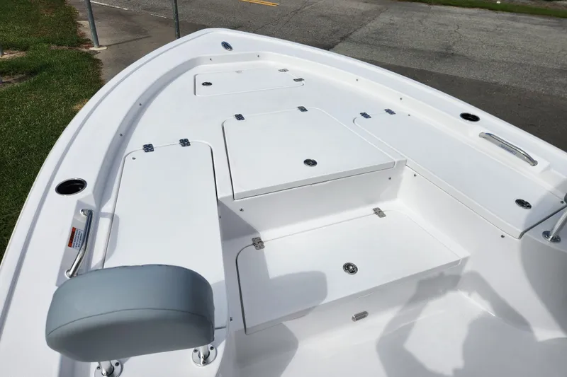 Slide: The Image of 2026 Sportsman Masters 247 Bay Boat deck with storage compartments and seating. - 11