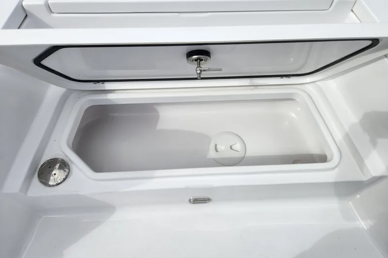 Slide: The Image of 2026 Sportsman Masters 247 Bay Boat storage compartment, open and empty. - 14