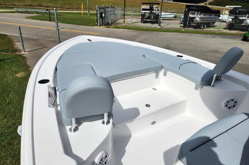 Slide: The Image of 2026 Sportsman Masters 247 Bay Boat with cushioned seating and spacious deck area. - 16