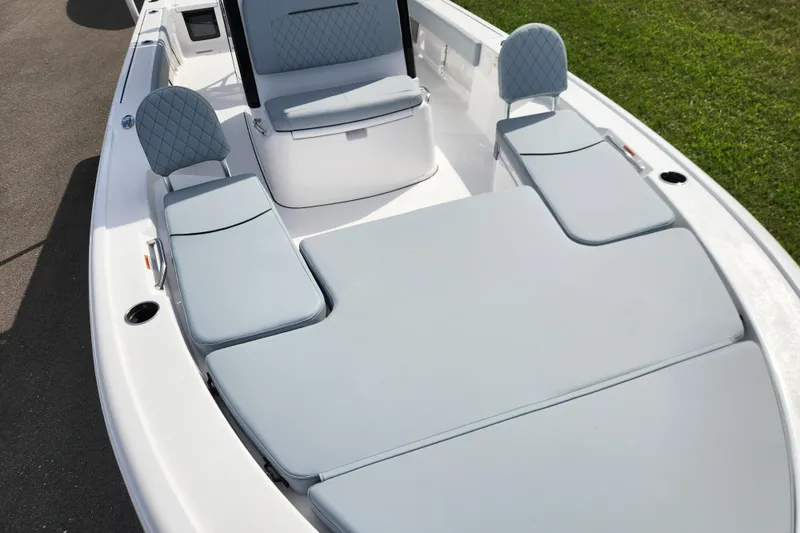 Slide: The Image of 2026 Sportsman Masters 247 Bay Boat interior with cushioned seating and sleek design. - 17