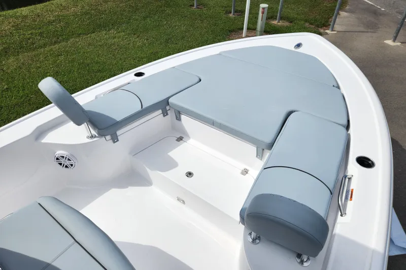 Slide: The Image of 2026 Sportsman Masters 247 Bay Boat interior with cushioned seating and storage compartments. - 18