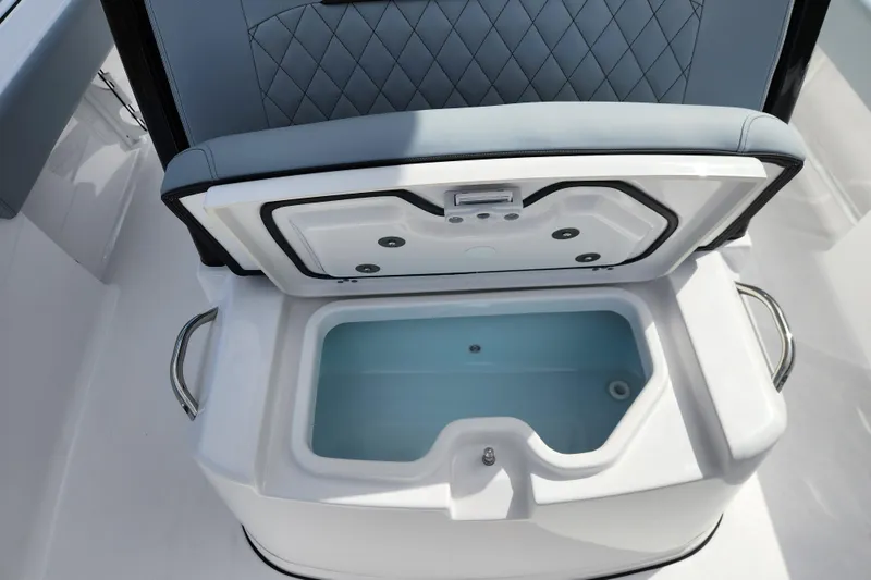 Slide: The Image of Open storage compartment on 2026 Sportsman Masters 247 Bay Boat, featuring cushioned seating. - 20
