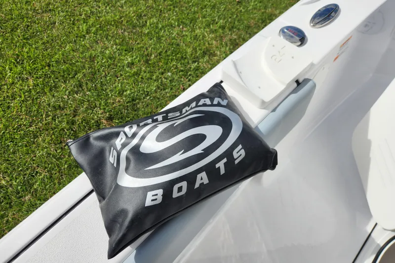 Slide: The Image of 2026 Sportsman Masters 247 Bay Boat with branded cushion on deck. - 33