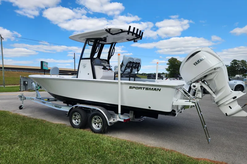 Slide: The Image of 2026 Sportsman Masters 247 Bay Boat on trailer, under clear blue sky. - 5