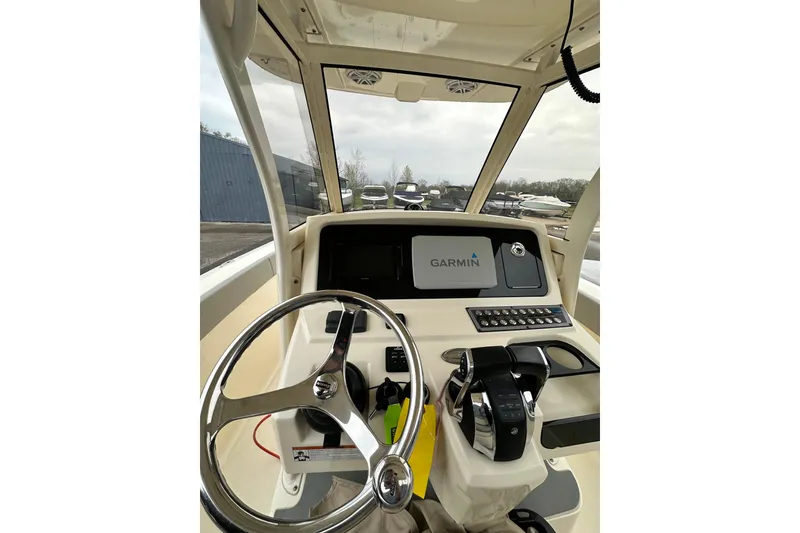 Slide: The Image of 2020 Scout 277 LXF boat dashboard with Garmin navigation system and steering wheel. - 10