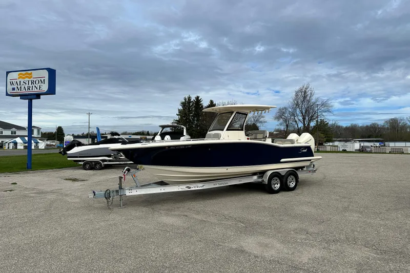 Slide: The Image of 2020 Scout 277 LXF boat on trailer at Walstrom Marine dealership. - 4