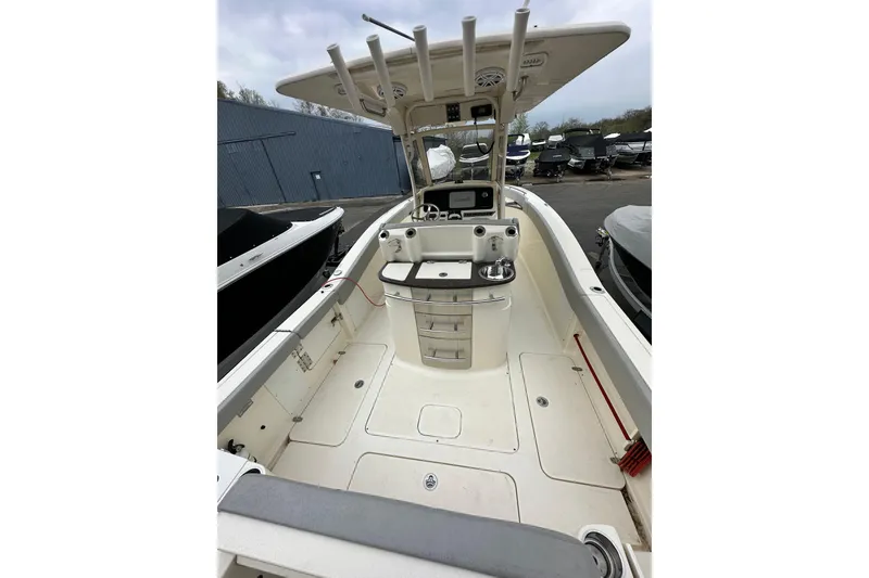 Slide: The Image of 2020 Scout 277 LXF boat interior with helm station and storage compartments. - 5