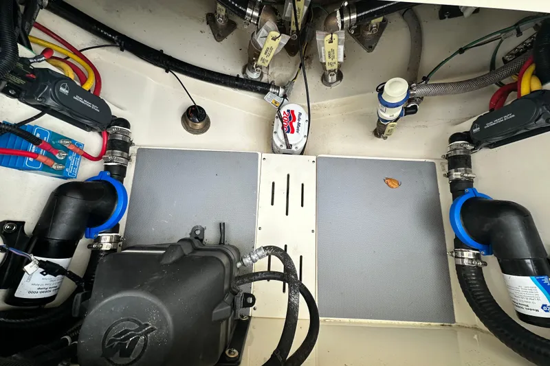 Slide: The Image of Engine compartment of 2020 Scout 277 LXF boat, showcasing wiring and components. - 7