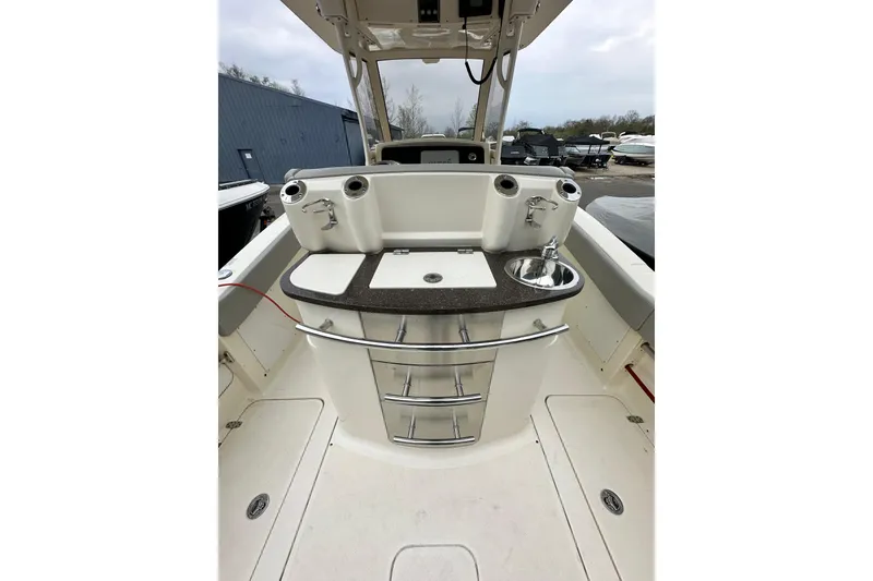 Slide: The Image of 2020 Scout 277 LXF boat interior with sink and storage drawers. - 8