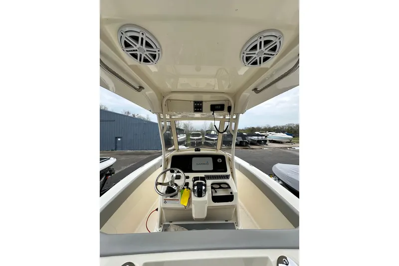Slide: The Image of 2020 Scout 277 LXF boat dashboard with steering wheel and navigation system. - 9