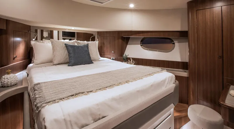 Slide: The Image of Luxurious bedroom interior of 2024 Belize 54 Daybridge yacht with modern wooden finishes. - 18