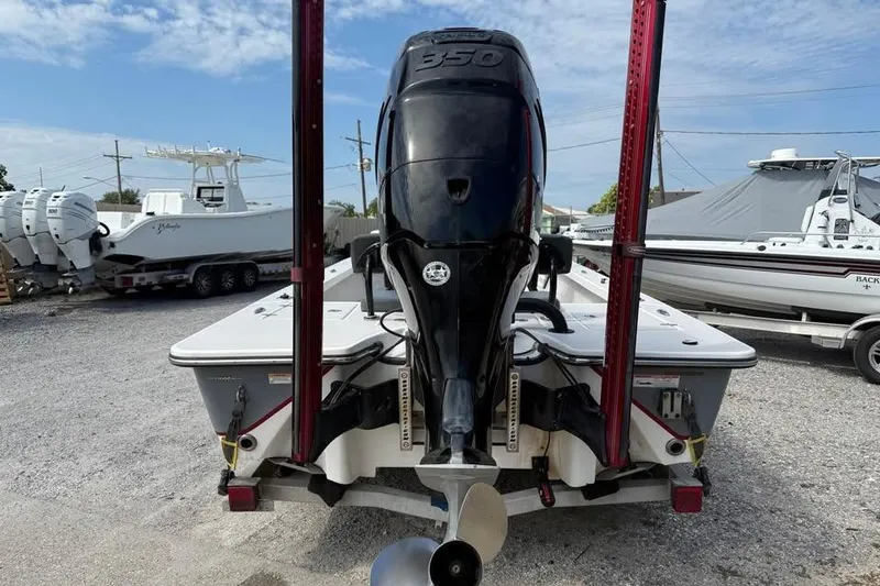 Slide: The Image of 2017 Blazer Bay 2420 GTS boat with powerful outboard motor, parked on gravel lot. - 3