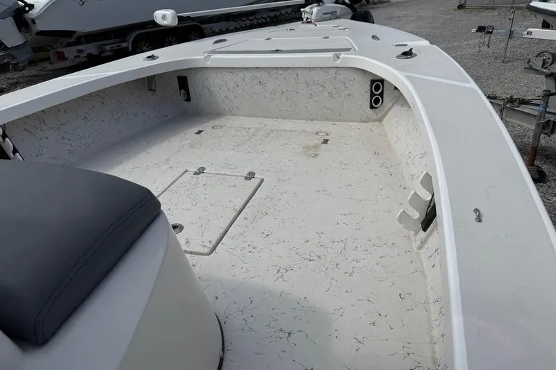 Slide: The Image of 2017 Blazer Bay 2420 GTS boat interior with spacious deck and storage compartments. - 5