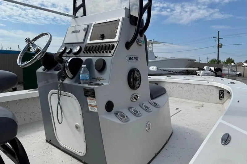 Slide: The Image of 2017 Blazer Bay 2420 GTS boat console with steering wheel and controls. - 6