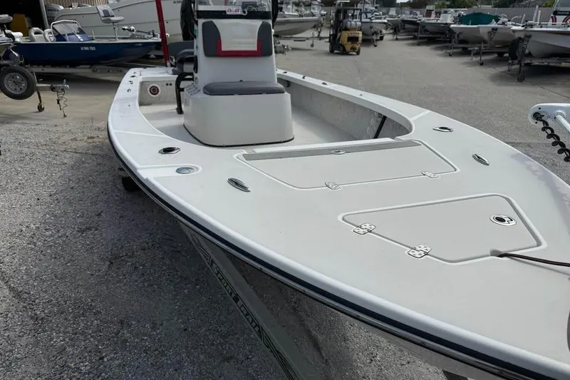 Slide: The Image of 2017 Blazer Bay 2420 GTS boat in storage yard, showcasing deck and seating. - 9