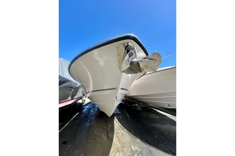 Slide: The Image of 2023 Boston Whaler 360 Outrage boat bow with anchor under clear blue sky. - 14