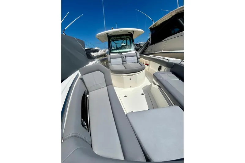 Slide: The Image of 2023 Boston Whaler 360 Outrage boat interior with sleek seating and modern design. - 9