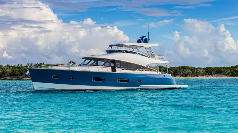 The Image of 2024 Belize 66 Daybridge yacht cruising in clear blue waters. - 0