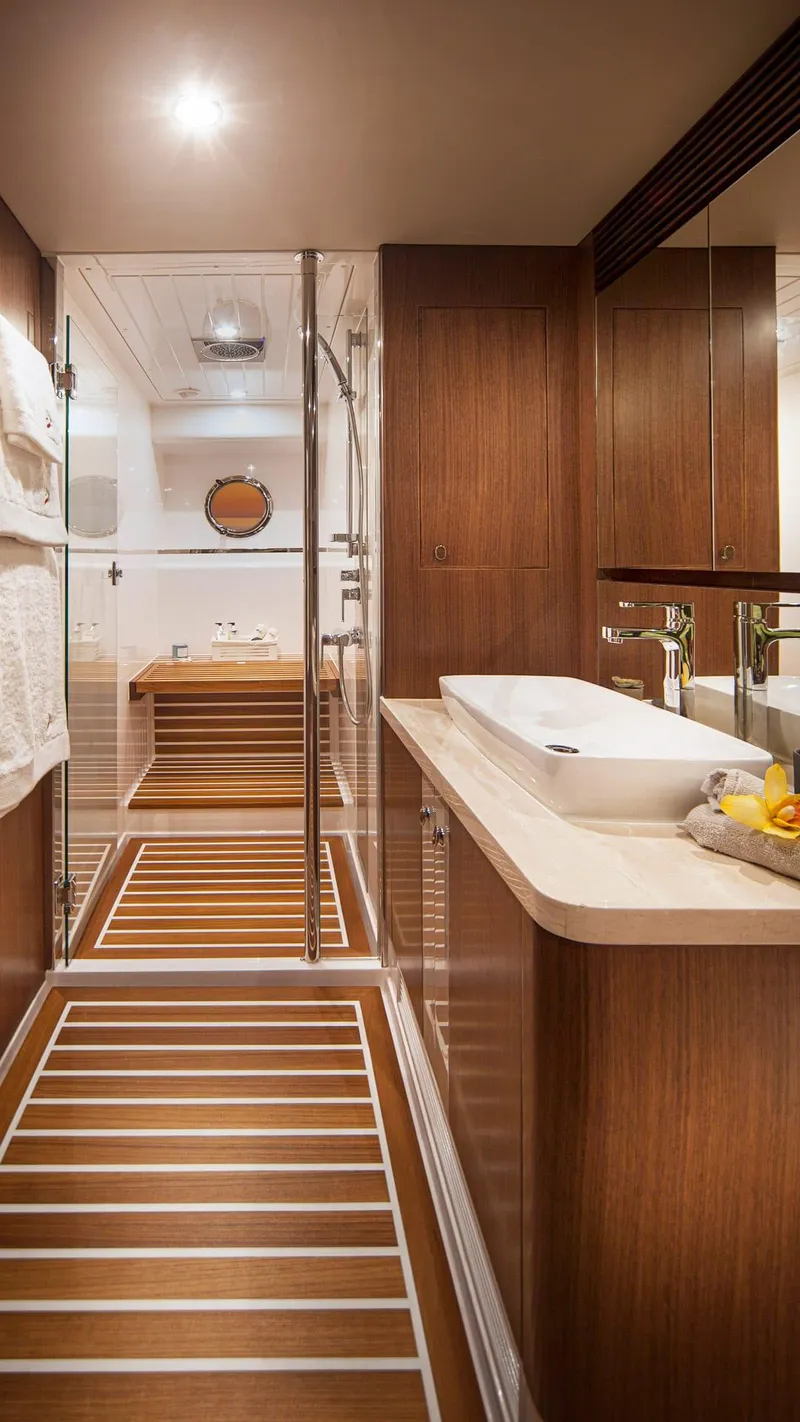 Slide: The Image of Luxurious bathroom interior of 2024 Belize 66 Daybridge yacht with wooden finishes. - 18
