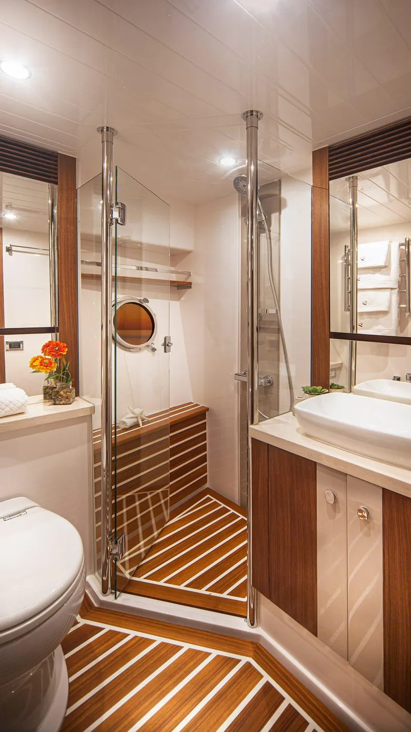 Slide: The Image of Luxurious bathroom in 2024 Belize 66 Daybridge yacht with modern fixtures and wooden accents. - 22
