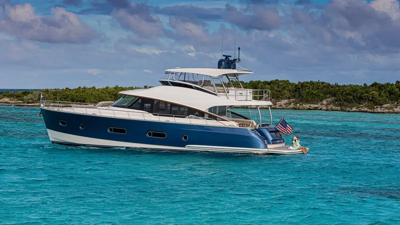 Slide: The Image of 2024 Belize 66 Daybridge yacht cruising in clear blue waters. - 5
