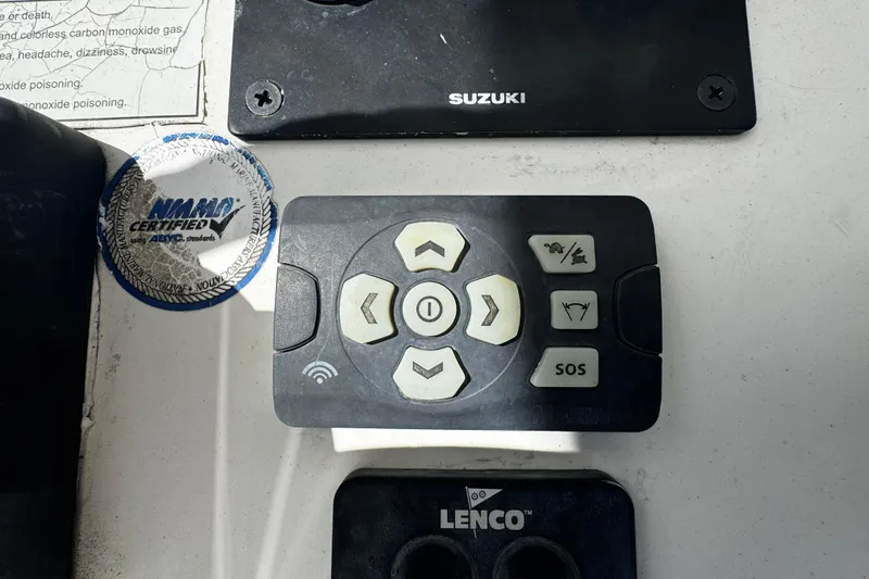 Slide: The Image of Control panel on a 2008 Sea Fox 287 CC boat with Suzuki and Lenco components. - 16
