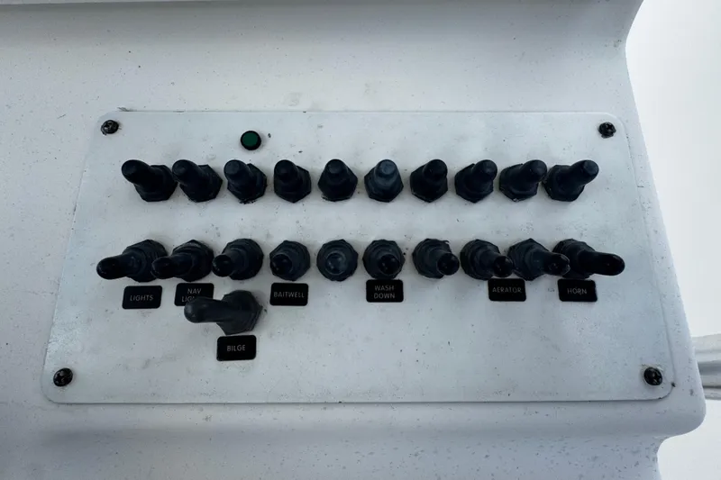 Slide: The Image of Control panel of a 2008 Sea Fox 287 CC boat with labeled switches. - 17