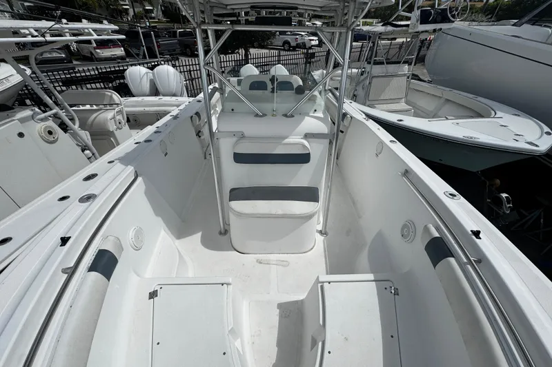 Slide: The Image of 2008 Sea Fox 287 CC boat interior with seating and storage compartments. - 22