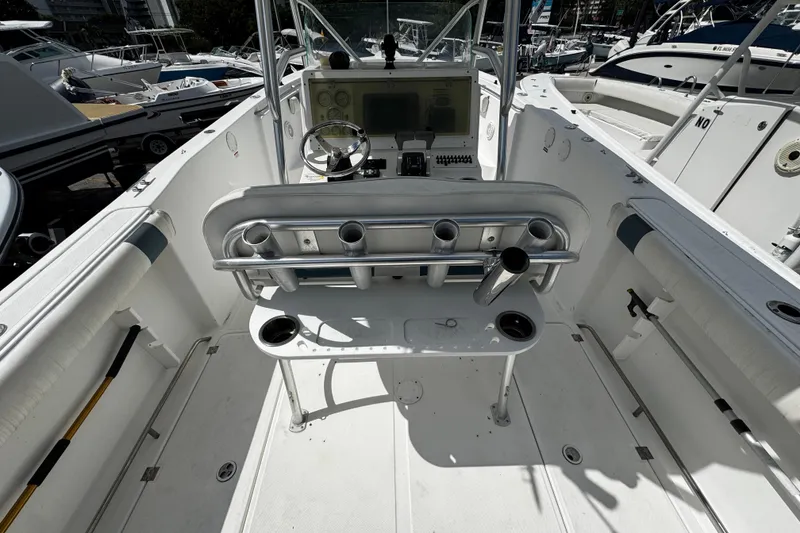 Slide: The Image of 2008 Sea Fox 287 CC boat interior with steering console and rod holders. - 8