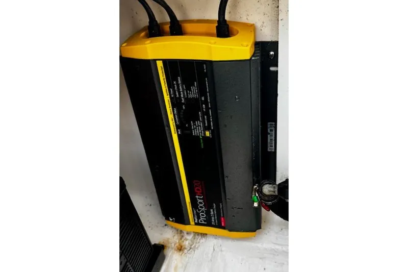 Slide: The Image of ProSport 20 battery charger in 2018 Pursuit DC 265 Dual Console boat. - 21