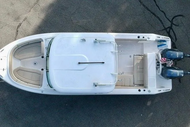 Slide: The Image of 2018 Pursuit DC 265 Dual Console boat, aerial view, showcasing seating and dual engines. - 9