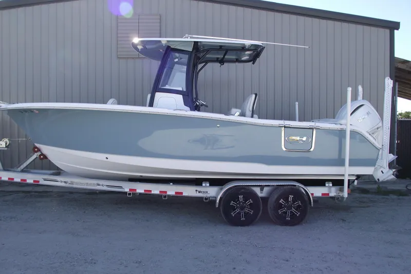 The Image of 2023 Sea Hunt Ultra 255 SE boat on trailer, side view. - 0