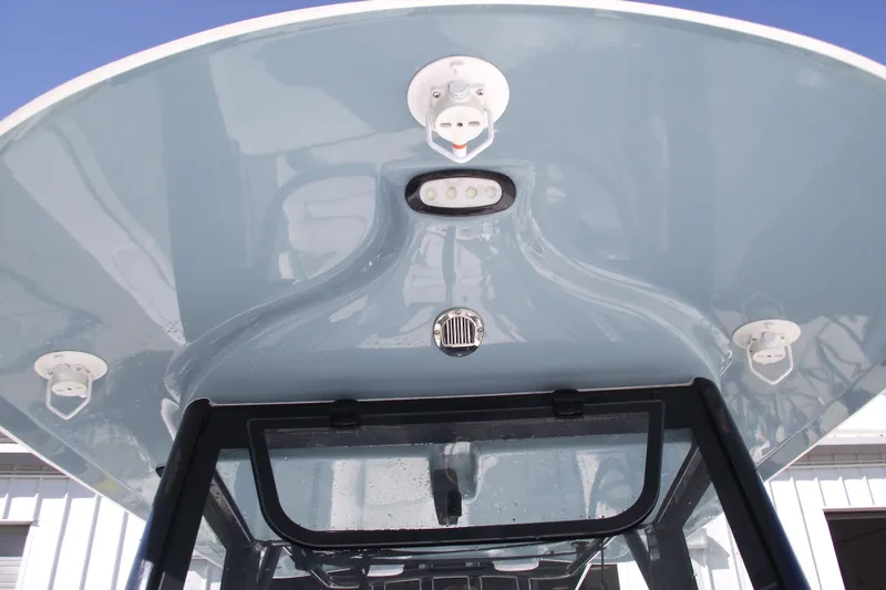 Slide: The Image of 2023 Sea Hunt Ultra 255 SE boat canopy with mounted lights and speakers. - 14