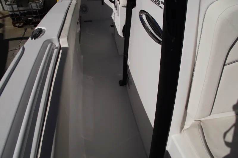 Slide: The Image of 2023 Sea Hunt Ultra 255 SE boat interior, featuring sleek white seating and modern design. - 15