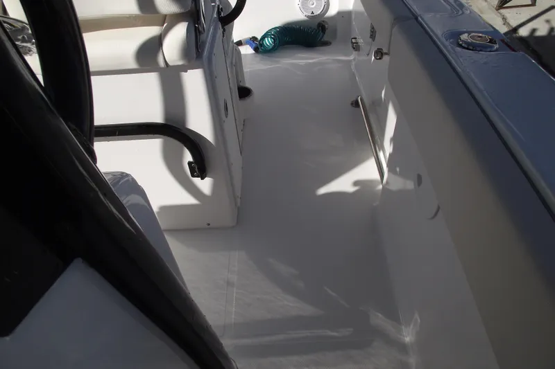 Slide: The Image of 2023 Sea Hunt Ultra 255 SE boat interior with seating and deck details. - 20