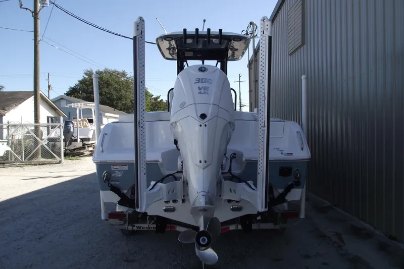 Slide: The Image of 2023 Sea Hunt Ultra 255 SE boat with powerful outboard motor. - 3