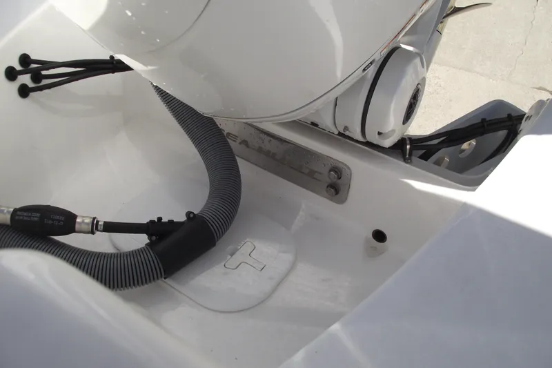 Slide: The Image of 2023 Sea Hunt Ultra 255 SE boat engine compartment with hoses and fittings. - 37