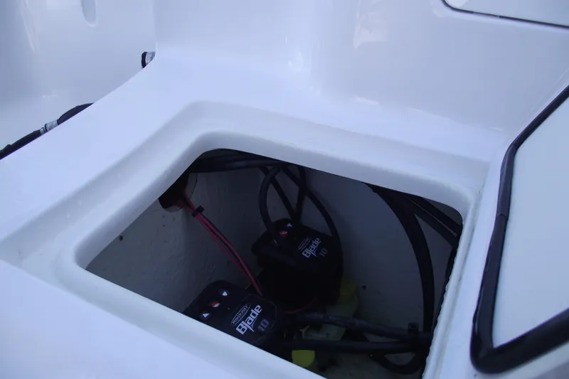 Slide: The Image of 2023 Sea Hunt Ultra 255 SE boat battery compartment with wiring. - 41