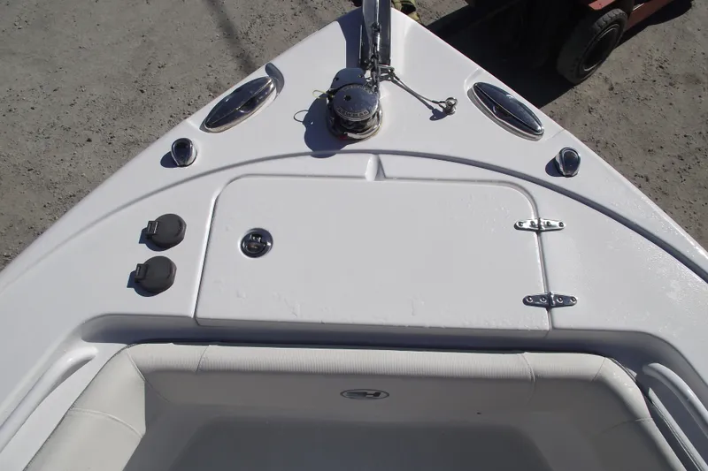 Slide: The Image of Bow view of 2023 Sea Hunt Ultra 255 SE boat, featuring storage compartment and fittings. - 6