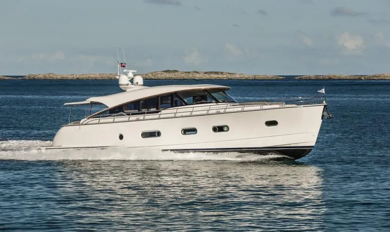 The Image of 2024 Belize 66 Sedan yacht cruising on open water. - 0